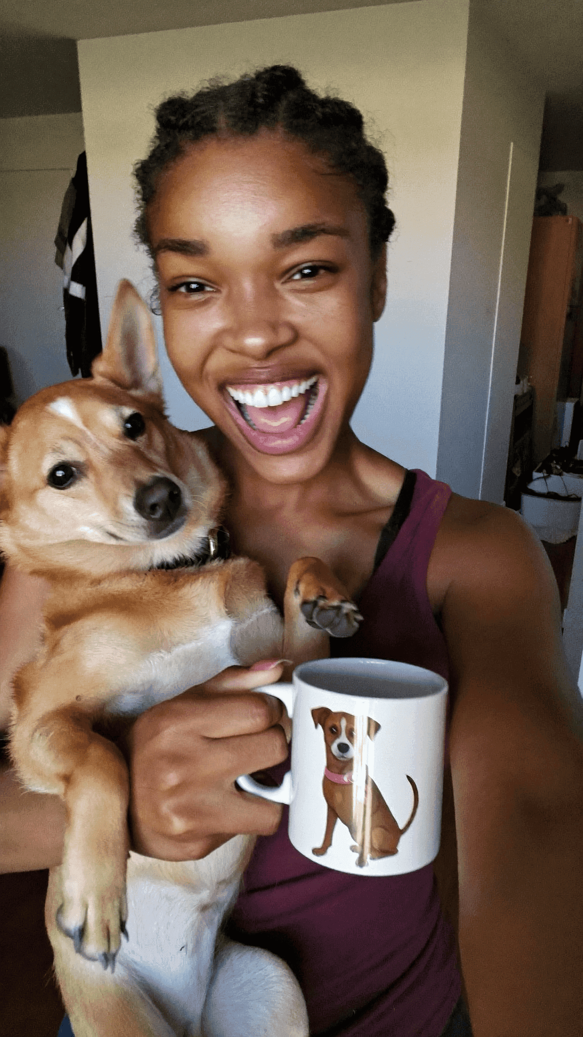 Girl selfie with dog and mug